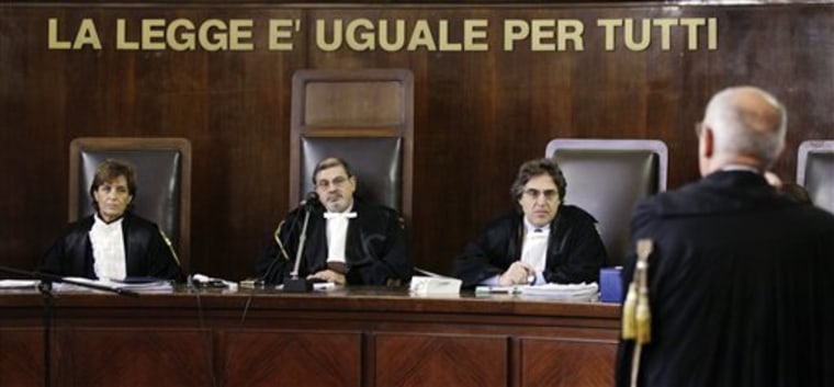 Judge Francesco Silocchi, center, looks on during a hearing at a Milan court Wednesday in which the covictions of 23 Americans in the kidnapping of an Egyptian terror suspect were upheld.